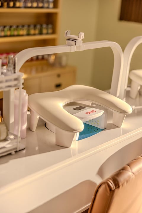 Modern white dental equipment with digital display on a treatment counter in a dental clinic room